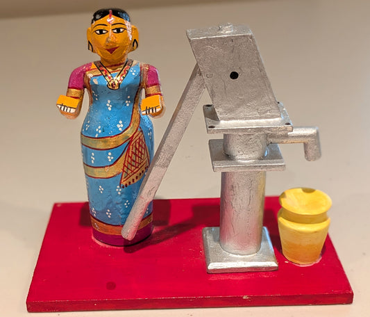 Woman at the Hand (Bore) Pump